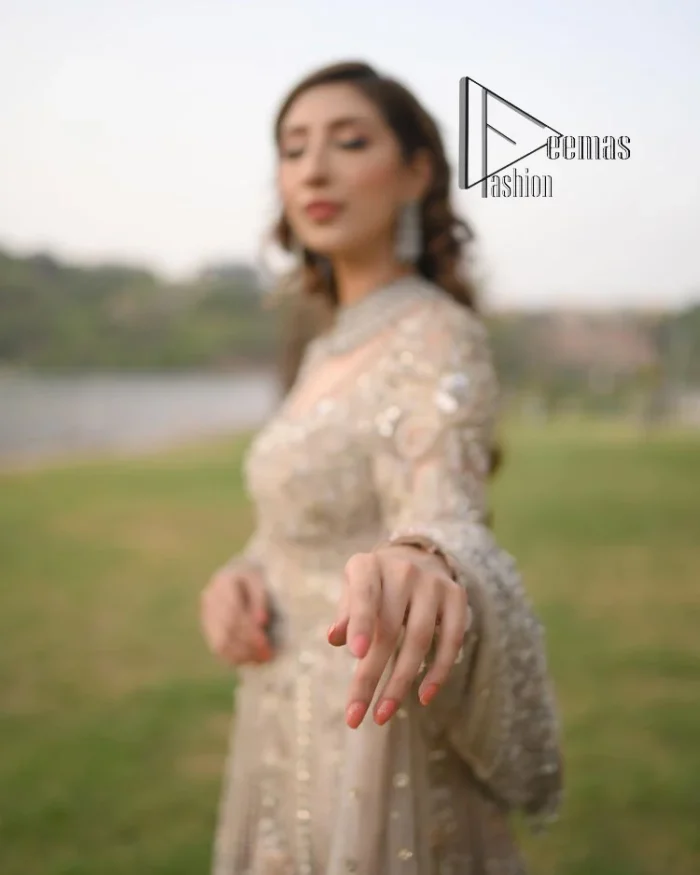 Start your new life by wearing DeemasFashion. Make your moment more memorable with light fawn heavy maxi nikah wear which is laboriously hand-rendered with silver and the same colour embroidery that enhances tilla, dabka, kora and crystal. The boat shape neckline and full sleeves of this maxi also add memorable beauty to your Qabool Hai moment. The maxi of this nikah wear is systemized with a dupatta in the same colour which is ornamented with four-sided borders and sequins sprayed all over to enhance the attractiveness of the nikah wear.