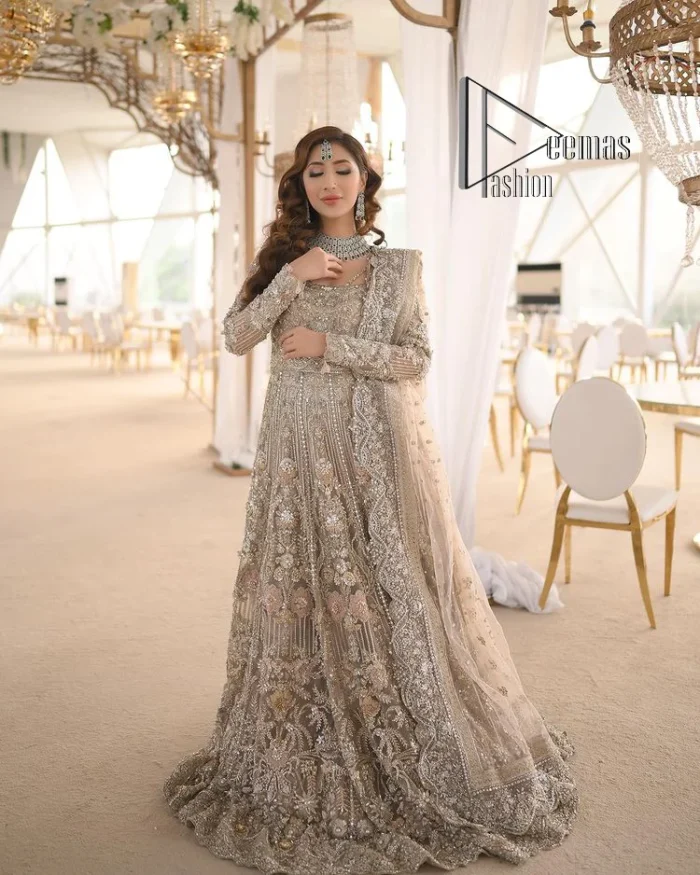 Start your new life by wearing DeemasFashion. Make your moment more memorable with light fawn heavy maxi nikah wear which is laboriously hand-rendered with silver and the same colour embroidery that enhances tilla, dabka, kora and crystal. The boat shape neckline and full sleeves of this maxi also add memorable beauty to your Qabool Hai moment. The maxi of this nikah wear is systemized with a dupatta in the same colour which is ornamented with four-sided borders and sequins sprayed all over to enhance the attractiveness of the nikah wear.