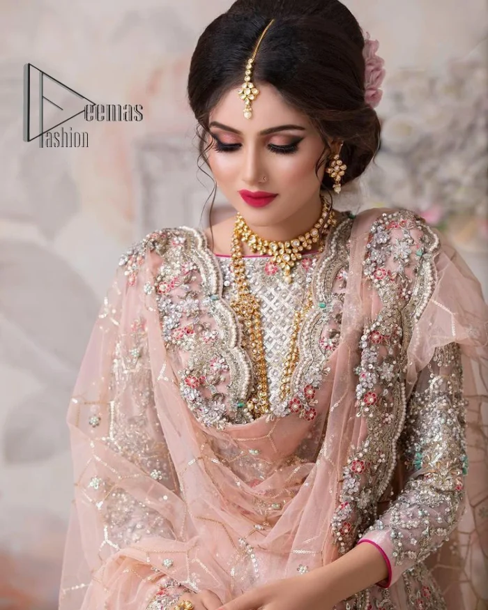 Don't worry, just be lilac on your nikah. As lilac is the most demanding nikah dress so DeemasFashion presents this nikah dress. Begin this with a lilac blouse which is diligently adorned with multi-colour embroidery to enhance the beauty of the nikah dress. Furthermore, it comes with boat shape neckline and full sleeves which are again highlighted with kora, dabka, tilla and crystal. The nikah dress is organized with a layered lehenga which is adorned with heavy embroidery all over. Complete this nikah dress with a scalloped dupatta which is sprinkled with sequins all over it. It is further furnished with a four-sided scalloped border.