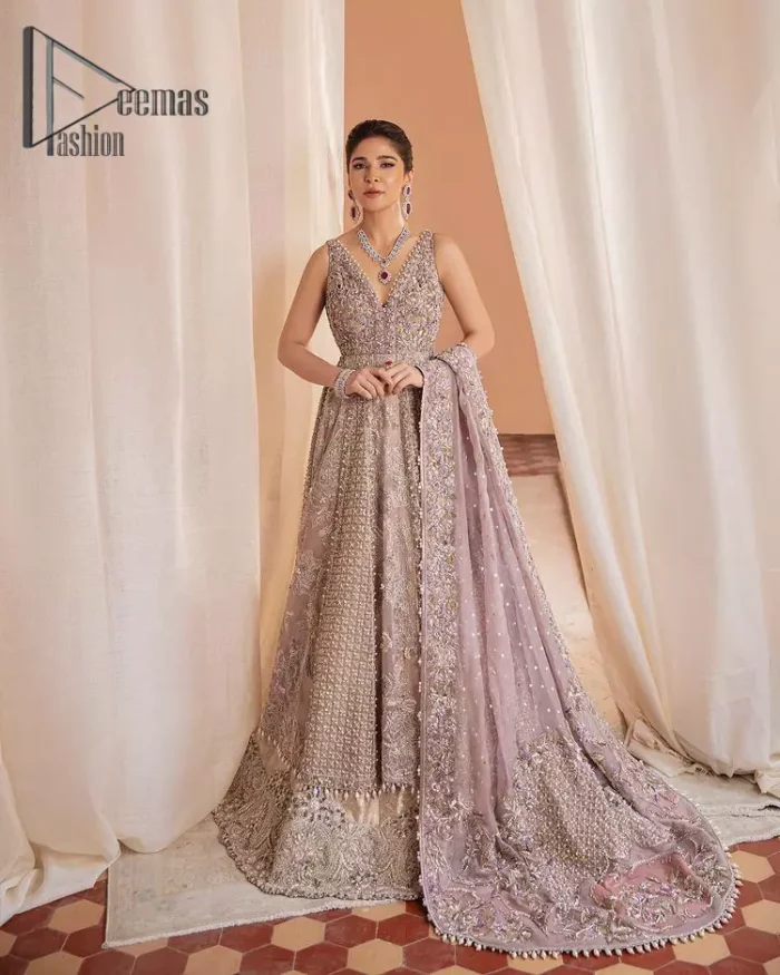 We know for most the girls a wedding dress represents more than just love. For our real special nikah dress , we present a lilac multiple panel maxi which is the embodiment of a dream and beautifully embellished with silver tilla, dabka and kora work. Furthermore, the sleeveless style of this multiple panel maxi is super amazing with V shape neckline just to introduce our love for the brides. This lilac maxi is organized with lilac lehenga just to give the contrast to your nikah day which is embellished with embroidery. Finish this special nikah dress look with a lilac dupatta which is heavily embellished with a four-sided border and sequins sprayed all over.