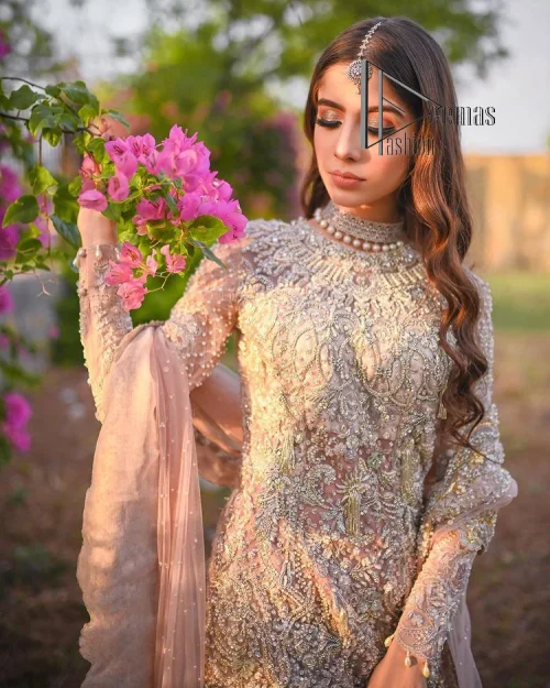 Introducing the mauve nikah outfit which begins with a short shirt that is meticulously and laboriously hand-rendered with silver embroidery