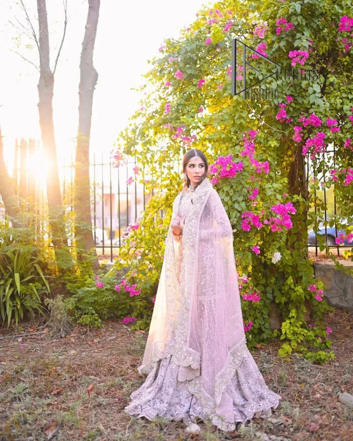 Introducing the mauve nikah outfit which begins with a short shirt that is meticulously and laboriously hand-rendered with silver embroidery which is embellished with tilla, dabka, and Sitara. Furthermore, the full sleeves of this nikah outfit are more attractive when come with a round-shaped neckline. It is coordinated with a fish-style heavy lehenga which is again ornamented with silver embroidery. Complete this nikah wear with a scalloped dupatta which is embellished with four-sided borders and sequins sprayed all over.