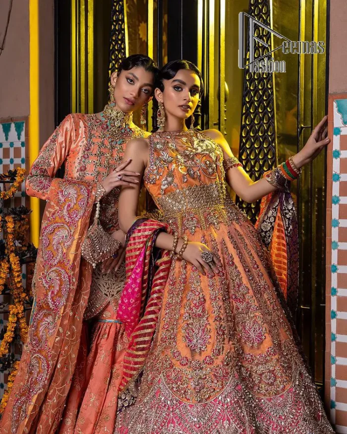 In a world full of trends, sometimes a bride just wants to wear something classic and traditional. In this way, DeemasFashion presents the major Pakistani walima dress which is nearest to the traditional style. The Pakistani walima dress starts from the orange pishwas which is beautifully styled with an illusion neckline and sleeveless. Further, it is enhanced with colourful embroidery which includes kora, dabka, tilla and Sitara to make your day super special. Pakistani walima dress is systemized with lehenga in the same colour but has a heavy green border to add beauty to the dress. Complete this Pakistani walima dress with a colourful dupatta to meet the following traditional trend.
