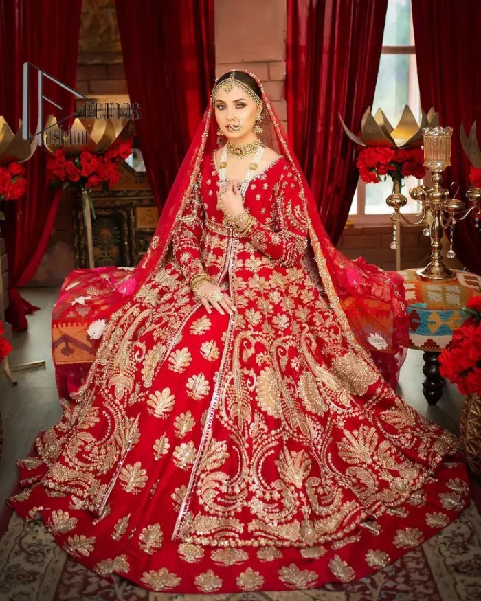 Red is the colour of love. Beating hearts and hungry lips. Red is always associated with Pakistani reception wear. Go ahead with a red front open maxi which is actively adorned with light golden embroidery and enhanced with tilla, kora, dabka and zardozi. Furthermore, the Pakistani reception wear is highlighted with V shape neckline and full sleeves to embrace the night of the event. The Pakistani reception wear is coordinated with a lehenga in the same colour which border is embellished with floral motifs. Complete this article with a dupatta in contrast to blue or red which is embellished with heavy embroidery as well to balance the artilcle.