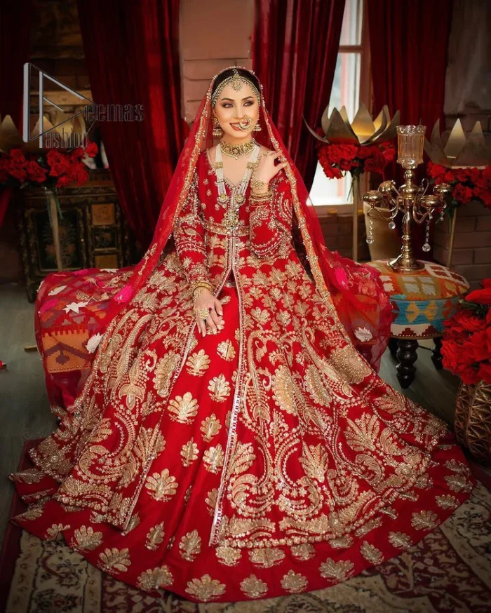 Red is the colour of love. Beating hearts and hungry lips. Red is always associated with Pakistani reception wear. Go ahead with a red front open maxi which is actively adorned with light golden embroidery and enhanced with tilla, kora, dabka and zardozi. Furthermore, the Pakistani reception wear is highlighted with V shape neckline and full sleeves to embrace the night of the event. The Pakistani reception wear is coordinated with a lehenga in the same colour which border is embellished with floral motifs. Complete this article with a dupatta in contrast to blue or red which is embellished with heavy embroidery as well to balance the artilcle.