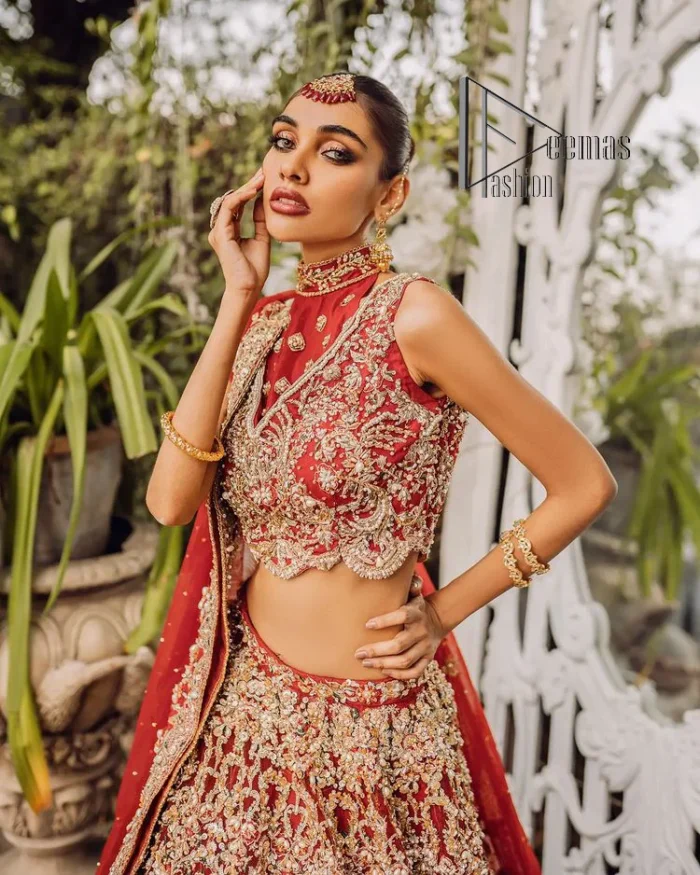 Every wedding comes with a bundle of emotion and love for the outfits. So, for this way DeemasFashion introduces this red reception wear which begins with a halter neck blouse which is exquisitely embellished with light golden embroidery which includes tilla, dabka, kora and zardozi. Further, the lehenga of this reception outfit is also adorned with heavy embroidery to boost your big day with love and emotions. Complete this reception wear with a dupatta in the same colour which is adorned with four-sided embellished borders and sequins sprayed all over.