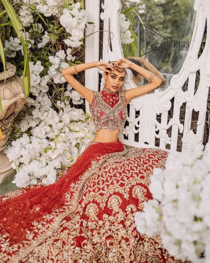 Every wedding comes with a bundle of emotion and love for the outfits. So, for this way DeemasFashion introduces this red reception wear which begins with a halter neck blouse which is exquisitely embellished with light golden embroidery which includes tilla, dabka, kora and zardozi. Further, the lehenga of this reception outfit is also adorned with heavy embroidery to boost your big day with love and emotions. Complete this reception wear with a dupatta in the same colour which is adorned with four-sided embellished borders and sequins sprayed all over.