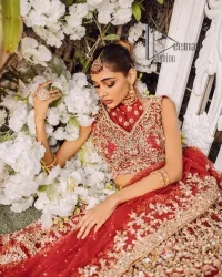 Every wedding comes with a bundle of emotion and love for the outfits. So, for this way DeemasFashion introduces this red reception wear which begins with a halter neck blouse which is exquisitely embellished with light golden embroidery which includes tilla, dabka, kora and zardozi. Further, the lehenga of this reception outfit is also adorned with heavy embroidery to boost your big day with love and emotions. Complete this reception wear with a dupatta in the same colour which is adorned with four-sided embellished borders and sequins sprayed all over.
