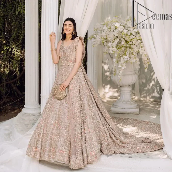 Boost your day with all about rose pink! Presenting the rose pink walima wear which begins with a heavy maxi that is beautifully hand-rendered with silver embroidery. It is attractively highlighted with tilla, dabka, kora and zardozi. The astonishing sleeveless style of the maxi looks super amazing when comes with a sweetheart neckline to make your day booster day. Furthermore, the back train of the maxi is also heavily ornamented. The walima wear is exquisitely paired up with a dupatta in the same colour which is embellished with four-sided borders and sequins sprayed all over.