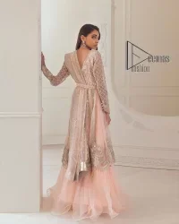 Every girl has a favourite deal with rose pink So DeemasFashion initiate this nikah wear in rose pink colour to embrace the love of brides. Starting this nikah wear with a pishwas which is beautifully styled with a double layer. The first layer is handsomely embellished with silver embroidery that includes tilla, kora, dabka and crystal. The other layer is beautifully styled with frill. Complete this nikah wear with a dupatta in the same colour adorned with a four-sided embellished border and sequins sprayed all over to make your nikah more memorable.