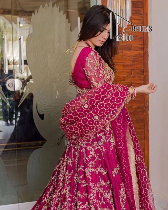 Stripes are the new pinky vibes. Introducing the Pakistani walima dress in the shade of shocking pink. This easy-breezy, romantic silhouette, is laboriously frosted with meticulously detailed golden embroidery which includes tilla, dabka, kora and Kundan. The handsome illusion neckline gives an extra soothing view to this Pakistani walima dress when comes with three-quarter sleeves. The heavily hand-rendered maxi is paired up with a dupatta in the same colour which is again embellished with four-sided borders and sequins sprayed all over to make your day super fresh.