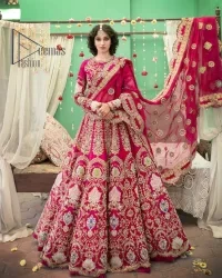 A wine that will make you rise and shine n your Big day. Begin this reception wear with wine red blouse which is beautifully adorned with golden embroidery and further enhance with tilla, dabka, kora and Sitara. The round shape neckline of the blouse meticulously comes with full sleeves. The reception wear also includes the flared lehenga in the same colour which is highlighted with multiple colour embroidery as well. In parallel to this, the dupatta in the same colour is heavily adorned with four-sided borders and floral motifs all over to make you rise and shine in this reception wear.