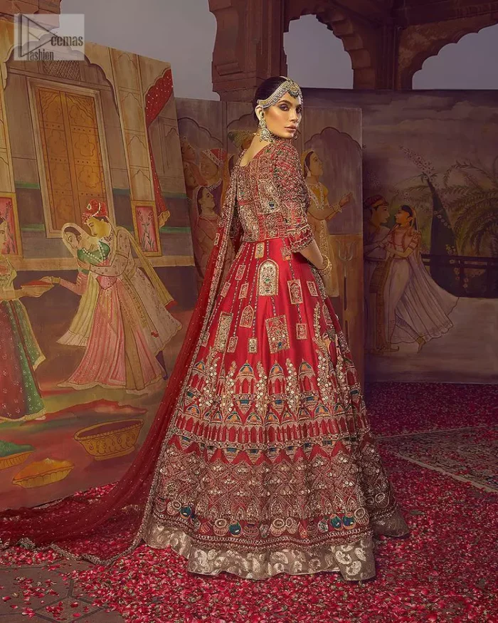 Stun in this classic canvas with crimson maroon adornment at your reception. DeemasFashion presents this outfit which begins with a maxi that is luxuriously encrusted with tilla, dabka, Resham, Sitara and specific shorts of zardozi. Scintillating with detailed embroidery in multiple-colour to make you the fashion start of the era. The round neckline of the maxi along with the three-quarter sleeves makes the traditional look. It is systemized with lehenga made with pure jamawar in ivory colour. Complete this article with a dupatta, framed with a four-sided border and sequins sprayed all over to fulfilling the promising stunning bride look.