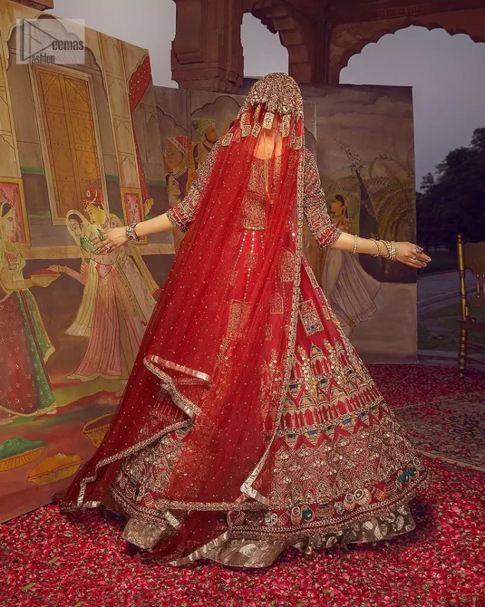 Stun in this classic canvas with crimson maroon adornment at your reception. DeemasFashion presents this outfit which begins with a maxi that is luxuriously encrusted with tilla, dabka, Resham, Sitara and specific shorts of zardozi. Scintillating with detailed embroidery in multiple-colour to make you the fashion start of the era. The round neckline of the maxi along with the three-quarter sleeves makes the traditional look. It is systemized with lehenga made with pure jamawar in ivory colour. Complete this article with a dupatta, framed with a four-sided border and sequins sprayed all over to fulfilling the promising stunning bride look.