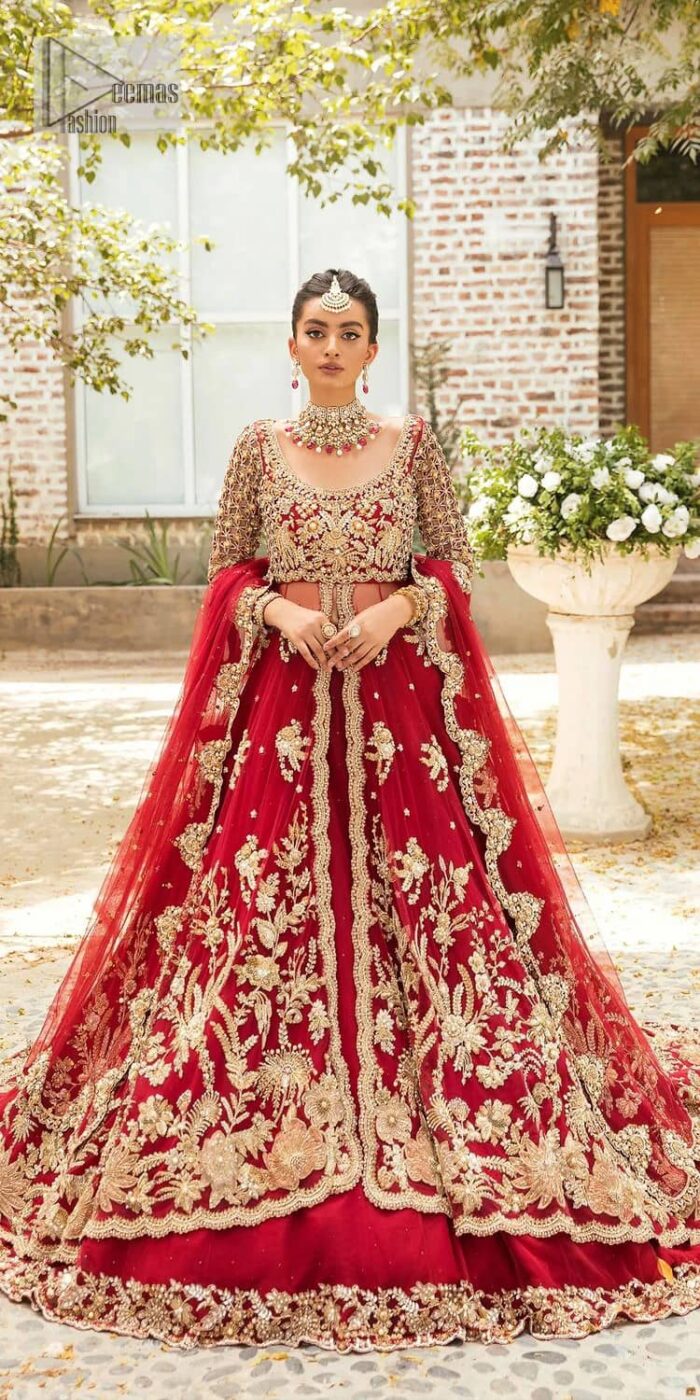 Vibrant outfit to make your reception day more shiny and bright. DeemasFashion presents this maxi in deep red colour, featuring golden embroidery which is enhanced with tilla, dabka, kora, naqshi, zardozi and the magic of Resham. The following scalloped front open maxi has a Round neckline to meet the traditional look when comes with three-quarter sleeves.  In addition to this, it is paired up with a back train lehenga in the same colour framed with embroidery on the border. Complete this article with a scalloped dupatta which is adorned with four-sided borders and sequins sprayed all over for sun-kissed splendour!