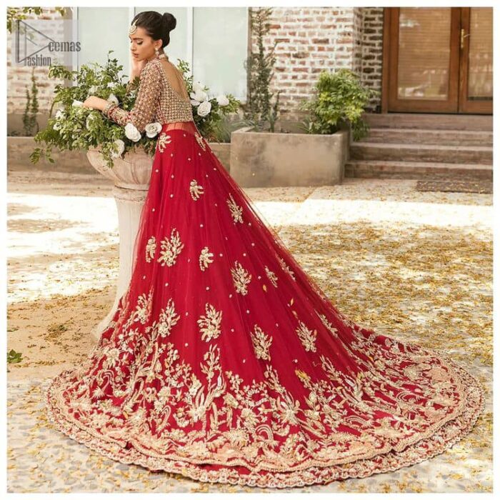 Vibrant outfit to make your reception day more shiny and bright. DeemasFashion presents this maxi in deep red colour, featuring golden embroidery which is enhanced with tilla, dabka, kora, naqshi, zardozi and the magic of Resham. The following scalloped front open maxi has a Round neckline to meet the traditional look when comes with three-quarter sleeves.  In addition to this, it is paired up with a back train lehenga in the same colour framed with embroidery on the border. Complete this article with a scalloped dupatta which is adorned with four-sided borders and sequins sprayed all over for sun-kissed splendour!