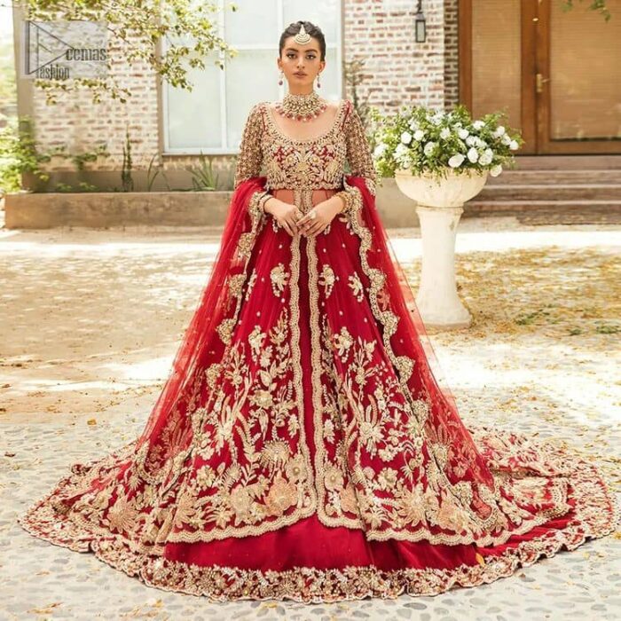 Vibrant outfit to make your reception day more shiny and bright. DeemasFashion presents this maxi in deep red colour, featuring golden embroidery which is enhanced with tilla, dabka, kora, naqshi, zardozi and the magic of Resham. The following scalloped front open maxi has a Round neckline to meet the traditional look when comes with three-quarter sleeves.  In addition to this, it is paired up with a back train lehenga in the same colour framed with embroidery on the border. Complete this article with a scalloped dupatta which is adorned with four-sided borders and sequins sprayed all over for sun-kissed splendour!