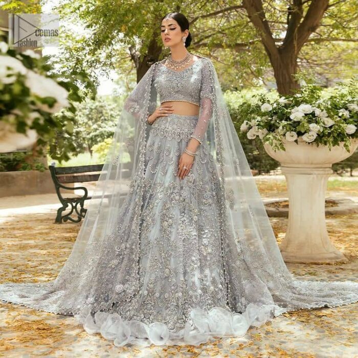 The magic of luxurious romantic outfits, giving you love at your Walima. The outfit defines the endless beauty of the immaculately produced pieces with intricate silver and golden embellishments, which are further magnified wth tilla, dabka, kora, Kundan and crystal. The full sleeve style of the blouse along with V shape neckline just gives you a unique way of artistic look. It is systemized with frilled lehenga which is heavily embellished with floral patterns to make your day more charming and delightful. Complete this article with a dupatta which is embellished with a four-sided border and ting floral motifs all over that are a dream of someone's special moment.