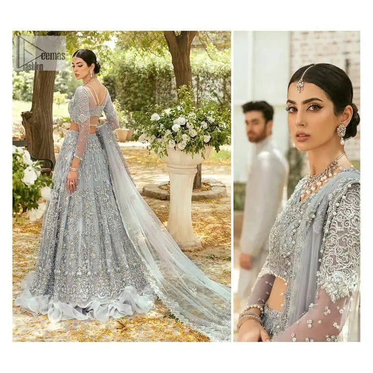 The magic of luxurious romantic outfits, giving you love at your Walima. The outfit defines the endless beauty of the immaculately produced pieces with intricate silver and golden embellishments, which are further magnified wth tilla, dabka, kora, Kundan and crystal. The full sleeve style of the blouse along with V shape neckline just gives you a unique way of artistic look. It is systemized with frilled lehenga which is heavily embellished with floral patterns to make your day more charming and delightful. Complete this article with a dupatta which is embellished with a four-sided border and ting floral motifs all over that are a dream of someone's special moment.