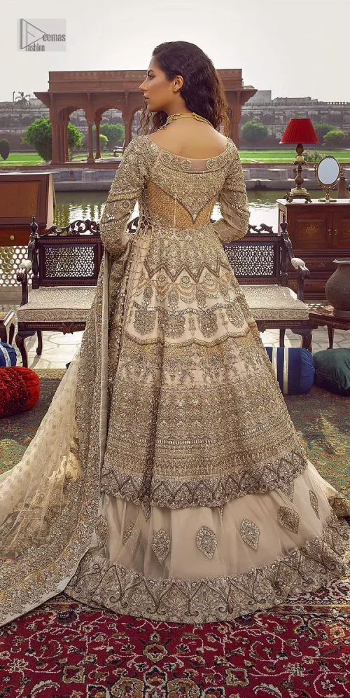 Capturing the essence of modernity on your Nikah with this ivory article. DeemasFashion presents this frock which is intricate with