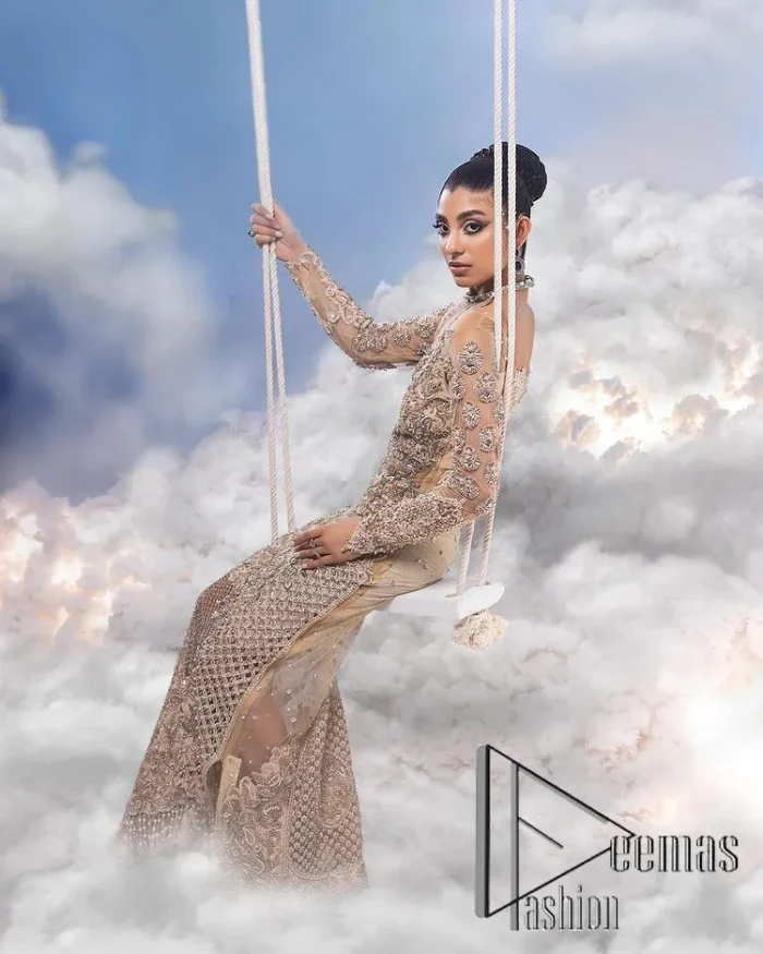 It was love at first swipe. A light fawn heavily hand-crafted maxi for an elegant daytime Nikah look. This light fawn maxi is handsomely embellished with tilla, dabka, kora, naqshi and zardozi which is further enhanced with silver embroidery. Further, the halter neckline along with full sleeves style is proven to guarantee that you stole the eyes and hearts of your loved ones. The floral pattern of the following maxi also increases the main focus of the maxi to make your day remarkable.