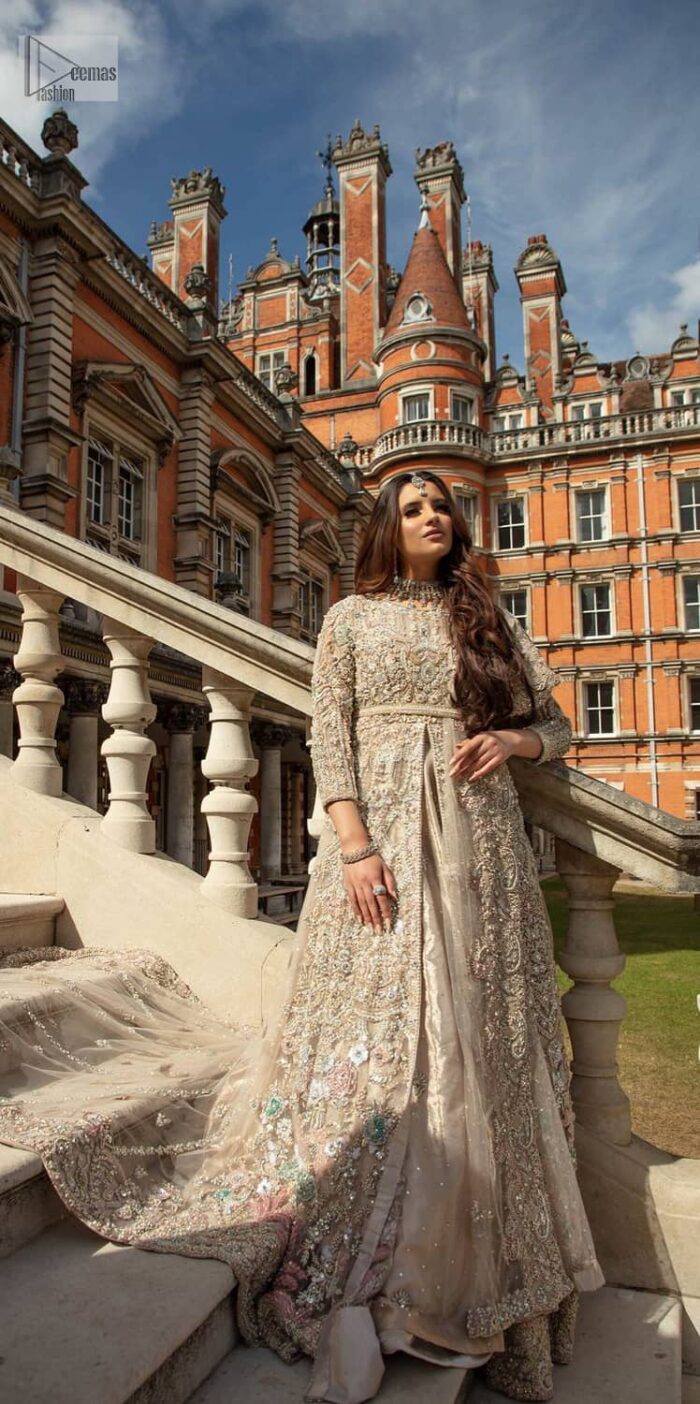 Filling the air with utmost happiness, joy ad fun for your Walima day. A handsome and attractive light fawn maxi laboriously roasted with meticulously detailed multiple colour hand embellishment which is further blooms with tilla, dabka, kora, naqshi and magic of Sitara. The jewel neckline of the following front open back train maxi looks so aesthetic when organized with three-quarter sleeves. It is paired up with lehenga in the same colour which is adorned with floral motifs and sequins spray spread all over to make your event more remarkable and shiny. Finish this article with the dupatta which is framed with magical four-sided borders and sequins sprayed all over to fulfil the dreamy fairy look.