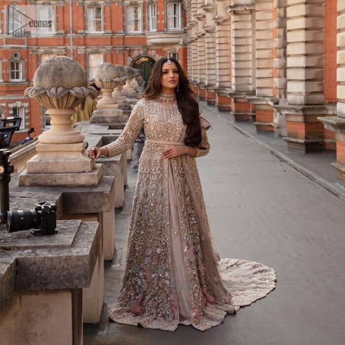Filling the air with utmost happiness, joy ad fun for your Walima day. A handsome and attractive light fawn maxi laboriously roasted with meticulously detailed multiple colour hand embellishment which is further blooms with tilla, dabka, kora, naqshi and magic of Sitara. The jewel neckline of the following front open back train maxi looks so aesthetic when organized with three-quarter sleeves. It is paired up with lehenga in the same colour which is adorned with floral motifs and sequins spray spread all over to make your event more remarkable and shiny. Finish this article with the dupatta which is framed with magical four-sided borders and sequins sprayed all over to fulfil the dreamy fairy look.
