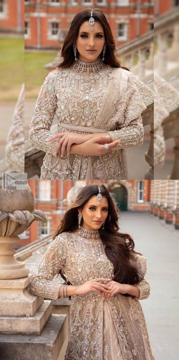 Filling the air with utmost happiness, joy ad fun for your Walima day. A handsome and attractive light fawn maxi laboriously roasted with meticulously detailed multiple colour hand embellishment which is further blooms with tilla, dabka, kora, naqshi and magic of Sitara. The jewel neckline of the following front open back train maxi looks so aesthetic when organized with three-quarter sleeves. It is paired up with lehenga in the same colour which is adorned with floral motifs and sequins spray spread all over to make your event more remarkable and shiny. Finish this article with the dupatta which is framed with magical four-sided borders and sequins sprayed all over to fulfil the dreamy fairy look.