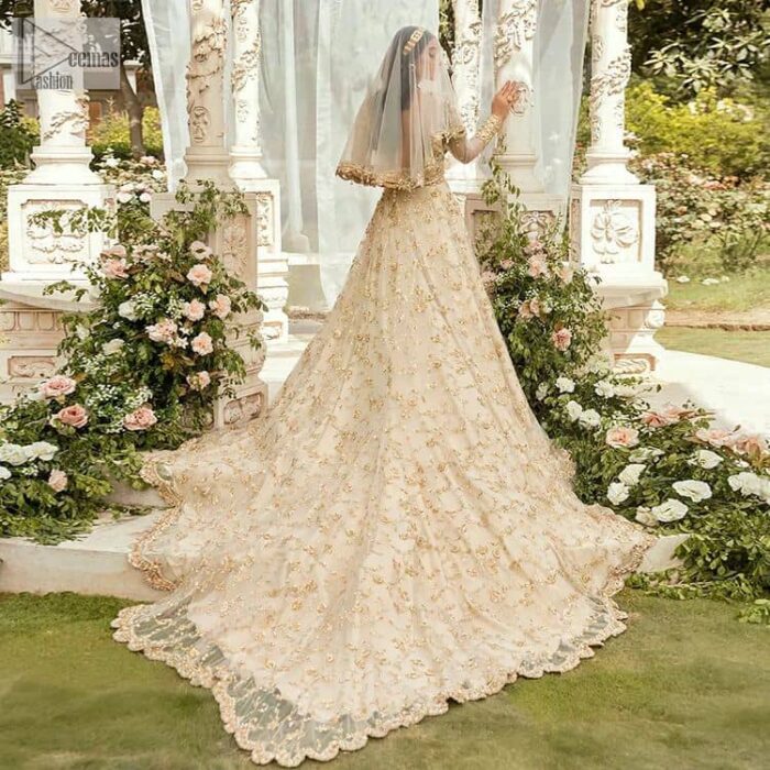 Mark your Nikah day in a calendar as a special one with this marvellous outfit. DeemasFashion presents this outfit in light fawn colour which begins with a back train scalloped maxi. The following maxi is sumptuously embellished with a golden embroidery which is further intensified with tilla, dabka, naqshi, Resham and zardozi. The sweetheart neckline of the maxi is heavily embellished and looks romantic when comes with full sleeves style. It is handsomely paired up with a lehenga in the same colour which is so plain to balance the look of the outfit. Finish this article with a scalloped dupatta which is embellished with four-sided borders and sequins sprayed all over to make your day more magical. 