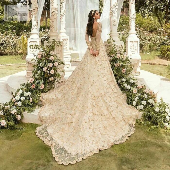 Mark your Nikah day in a calendar as a special one with this marvellous outfit. DeemasFashion presents this outfit in light fawn colour which begins with a back train scalloped maxi. The following maxi is sumptuously embellished with a golden embroidery which is further intensified with tilla, dabka, naqshi, Resham and zardozi. The sweetheart neckline of the maxi is heavily embellished and looks romantic when comes with full sleeves style. It is handsomely paired up with a lehenga in the same colour which is so plain to balance the look of the outfit. Finish this article with a scalloped dupatta which is embellished with four-sided borders and sequins sprayed all over to make your day more magical. 