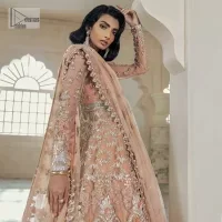 Be the happiest bride in your Walima as the orange colour is the most optimistic among all. The light orange front open maxi is complemented with delicate silver embroidery, further enhanced with the beautiful detailing which includes tilla, dabka, kora, Kundan and the real magic of crystal to make you the star of the show. The high neckline also looks like a unique masterpiece when it comes with full sleeves. It is organized with a flared lehenga that is also adorned with heavy embroidery. The flare of the following lehenga gives a dreamy fairy look to every bride. Complete this outfit with a scalloped dupatta in the same colour framed with four-sided borders and floral motifs all over to win the quote of the happiest bride.