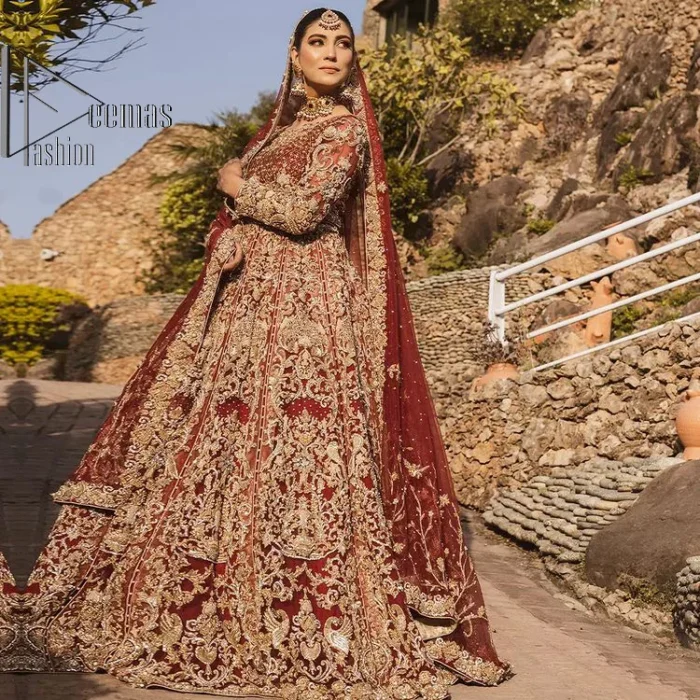 Love is in the air. A maroon blouse in maroon colour is hand-rendered in gold and is enhanced with naqshi, tilla, dabka, and kora along with the magic of zardozi. The boat shape neckline of the following blouse is pleasing to the outfit when combined with full sleeves to make your reception day more memorable. The flared lehenga in the same colours has gorgeous embroidery patterns and is paired up with a dupatta which is framed with a four-sided embellished border. It is further prominent with a sequin spray to give you the look of a model of the era.