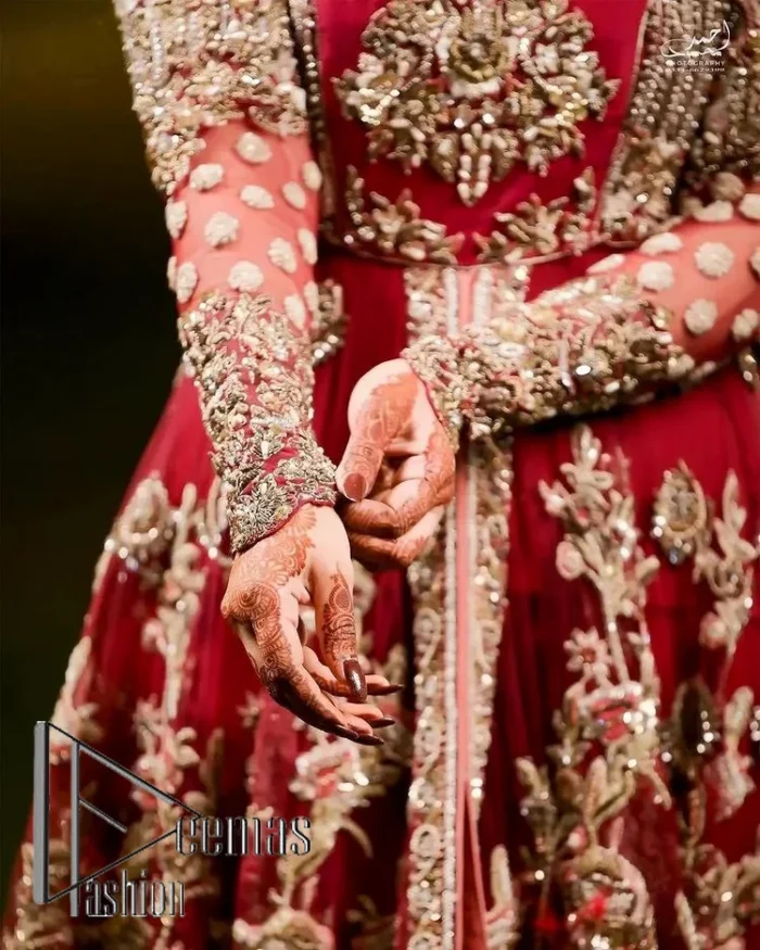 The magic of luxurious romantic silhouettes, giving out love and letting it come in. A maroon frilled maxi that is purely designed for your reception and hand-crafted with Sitara, pearls, tilla , and dabka along with the magic of zardozi. Further, it is handsomely ornamented with multiple embroideries to steal everyone's heart. The round shape neckline enhances the beauty of the outfit when comes with full sleeves to make you the star of the show. The front open style of the maxi truly makes you a unique bride of all eras.