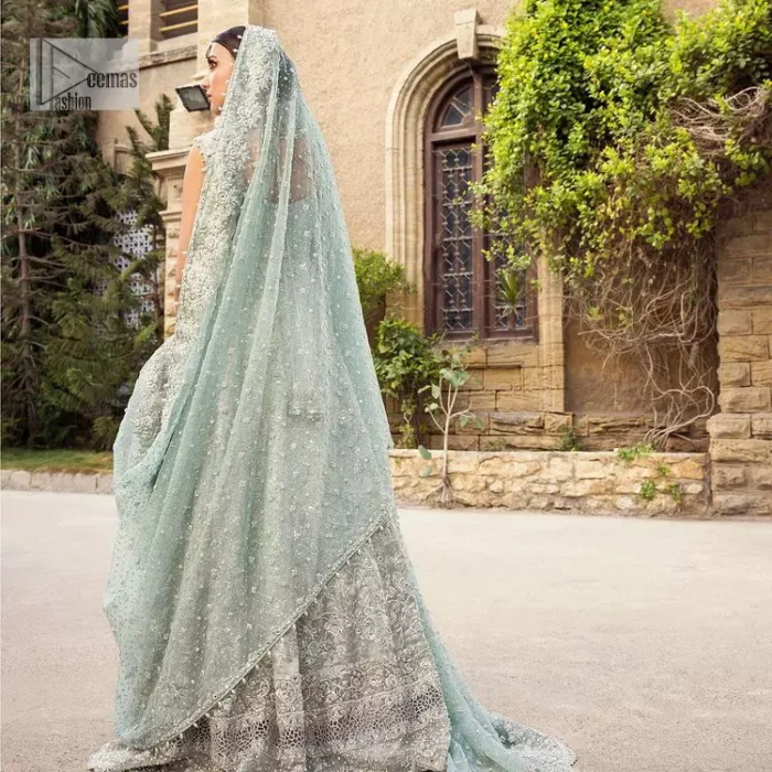 For the love of blue! A raw silk pale blue maxi with a heavy border is beautifully embroidered in silver colour. The maxi is enhanced with tilla, dabka, kora, Kundan, Sitara and detailing of resham. The round shape neckline is also beautifully decorated with silver embroidery to enhance the sleeveless style of the following maxi. It is paired up with a scalloped dupatta which is ornamented with four-sided borders and sequins sprayed all over in the same colour leaving you at the start of the Nikah event.