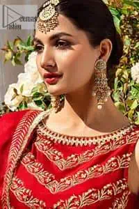 Master of artists who are the secret keepers of the canvas made the perfect shade of red for you to wear at your reception. A pure organza canvas of blouse, dipped in the richest shade of red, is adorned with dabka, sequins, tilla, kora and the magic of Resham. The following blouse is further magnified with golden embroidery with the highest attention to detail. The Round shape neckline of the blouse gives so romantic look when comes with a sleeveless style. It is paired u with flared and fluffy lehenga in silk whose bottom is heavily embellished. Complete this outfit with an organza dupatta framed with four-sided borders to be the star of the show.