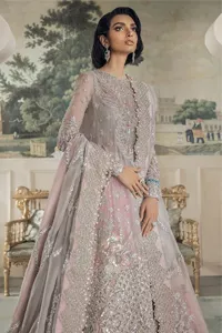Define your true self with an outfit that speaks for its beauty. DeemasFashion introduces this rose pink maxi which is beautifully hand-crafted with silver embroidery encapsulated with tilla, dabka, kora, Kundan ad zardozi. The upper side of the maxi is adorned with tiny floral motifs to give you a sweet treat on your Walima day. Further, the high neckline along with full sleeves intensifies the beauty of the outfit. It is paired up with sharara which is best for your walima day to give you a memorable and unique look. Complete this article with a dupatta in the same colour which is adorned with a four-side border to define your self-love.