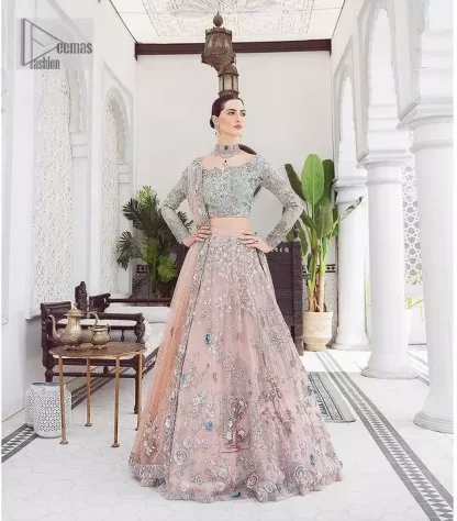 When you asked for it, we heard it. This sea green hued blouse has multiple colour embroidered details of tilla,dabka, kora, zari and sequin. It has a sweetheart neck and full sleeves style for gaining full attractiveness on your Nikah. The following blouse is organized with tea rose lehenga which is heavily embellished to make this masterpiece more aesthetic and cool.  Complete this article with a dupatta which is adorned with a four-sided embellished border. Further, it is enhanced with a sequin spray that you actually want for your big day.