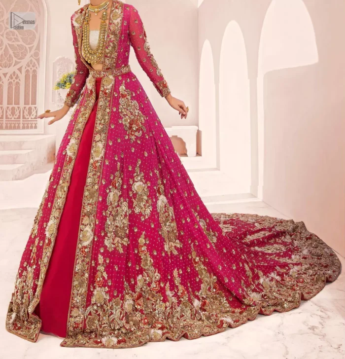 A maxi in a beautiful shade of shocking pink is deftly adorned with glowing tilla, dabka and pearls making this ensemble truly ethereal and incandescent. The following maxi is further enhanced with golden embroidery and laden with heavy floral motifs. The strapless neckline of the back train maxi also added more beauty to the outfit when comes with full sleeves. It is paired up with a plain can-can lehenga in the red colour to balance the reception fairy look of the bride. Finish this article with a dupatta which is ornamented with a four-sided embroidery and spray of tiny floral motifs and sequins all over for more romanticness and charmeness.