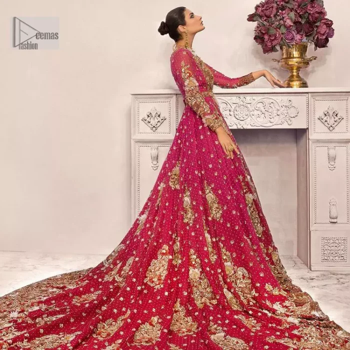 A maxi in a beautiful shade of shocking pink is deftly adorned with glowing tilla, dabka and pearls making this ensemble truly ethereal and incandescent. The following maxi is further enhanced with golden embroidery and laden with heavy floral motifs. The strapless neckline of the back train maxi also added more beauty to the outfit when comes with full sleeves. It is paired up with a plain can-can lehenga in the red colour to balance the reception fairy look of the bride. Finish this article with a dupatta which is ornamented with a four-sided embroidery and spray of tiny floral motifs and sequins all over for more romanticness and charmeness.