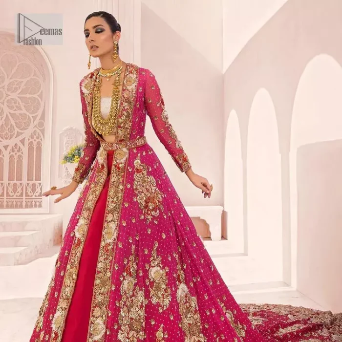 A maxi in a beautiful shade of shocking pink is deftly adorned with glowing tilla, dabka and pearls making this ensemble truly ethereal and incandescent. The following maxi is further enhanced with golden embroidery and laden with heavy floral motifs. The strapless neckline of the back train maxi also added more beauty to the outfit when comes with full sleeves. It is paired up with a plain can-can lehenga in the red colour to balance the reception fairy look of the bride. Finish this article with a dupatta which is ornamented with a four-sided embroidery and spray of tiny floral motifs and sequins all over for more romanticness and charmeness.
