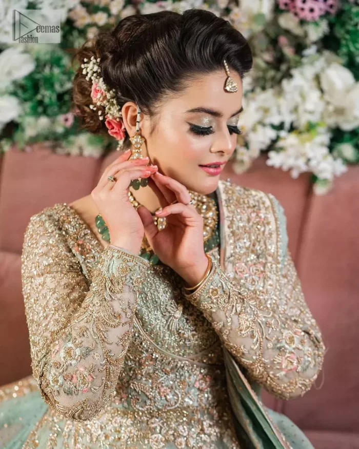 Unique embroidery designs to add some sparkle to your style on your Nikah! Light blue angrakha maxi with delicate multiple colour embroideries and intricate hand embellishments of tilla, dabka, kora, Kundan and crystals on the classic silhouette. Designed to flaunt your best features, the full sleeves carry beautiful embroidery with a square neckline. The following maxi along with the back train lehenga gives this outfit a unique look. Paired with a dreamy dupatta framed with embellished borders, this look is the epitome of ethereal and easy elegance.