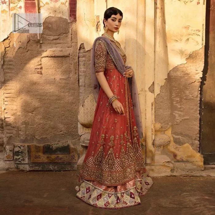 Get dreamy, get cosy and get ready for the party event. DeemasFashion presents coral frot open maxi with boat shape neckline. It is decorated with golden embroidery which enhances with tilla, dabka, kora, Kundan and the real magic of Zardozi. Fully worked half sleeves make this article so soothing and attractive. The following maxi is systemized with brocade sharara that has an ethnic charm and changes your appearance. Complete this article with a dupatta in the lilac colour framed with a four-sided border. The dupatta is enhanced with tiny floral motifs that give a charming finishing look to the dress.