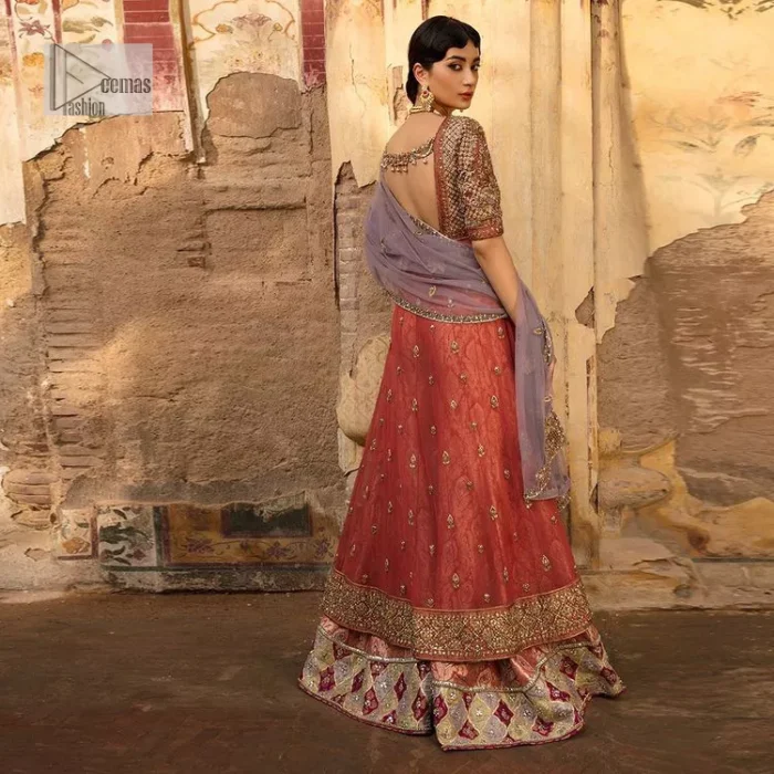 Get dreamy, get cosy and get ready for the party event. DeemasFashion presents coral frot open maxi with boat shape neckline. It is decorated with golden embroidery which enhances with tilla, dabka, kora, Kundan and the real magic of Zardozi. Fully worked half sleeves make this article so soothing and attractive. The following maxi is systemized with brocade sharara that has an ethnic charm and changes your appearance. Complete this article with a dupatta in the lilac colour framed with a four-sided border. The dupatta is enhanced with tiny floral motifs that give a charming finishing look to the dress.