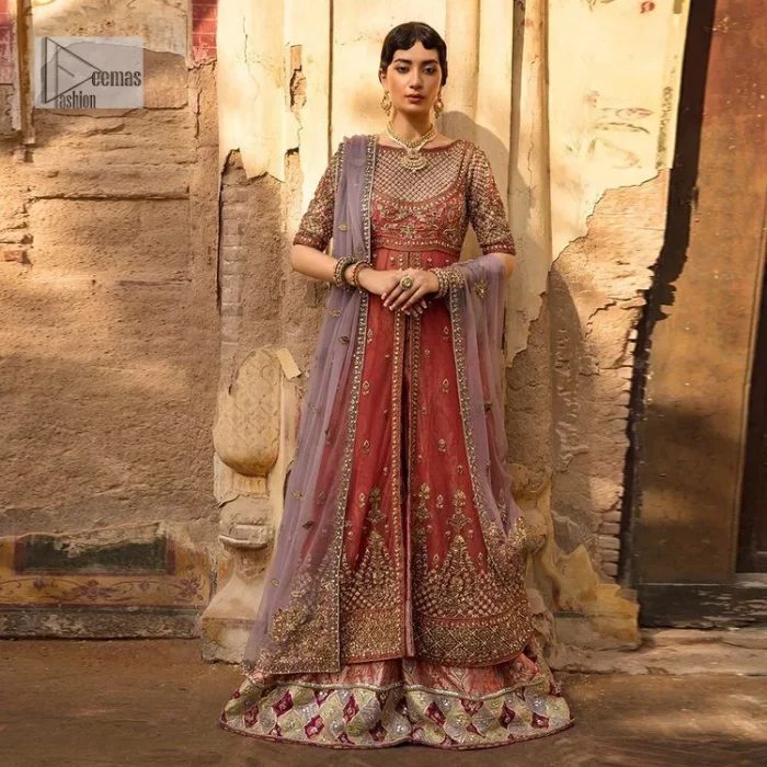 Get dreamy, get cosy and get ready for the party event. DeemasFashion presents coral frot open maxi with boat shape neckline. It is decorated with golden embroidery which enhances with tilla, dabka, kora, Kundan and the real magic of Zardozi. Fully worked half sleeves make this article so soothing and attractive. The following maxi is systemized with brocade sharara that has an ethnic charm and changes your appearance. Complete this article with a dupatta in the lilac colour framed with a four-sided border. The dupatta is enhanced with tiny floral motifs that give a charming finishing look to the dress.