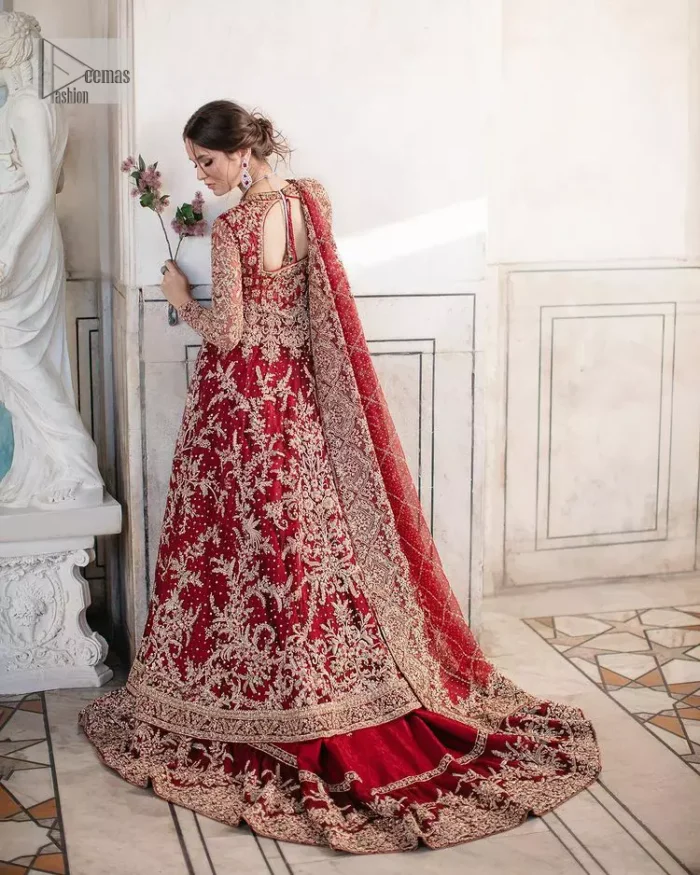 Bright and blissful! This ensemble is the epitome of grace.  The maxi is fully emblazoned with tilla, dabka, kora, Kundan and details of Zardozi. Intricate designs and fine details of golden embroidery give a perfect finishing look to the blouse. Further, embellishment full sleeves give a stunning touch to the blouse. The following blouse is further enhanced with V shape neckline. It is paired up with a lehenga that is ornamented with beautiful embroidery. The Lehenga has a huge flare and long tail. The outfit achieves the final ravishing look when paired with a delicate dupatta. The borders of this dupatta are hand-embellished and decorated with sequins sprayed.
