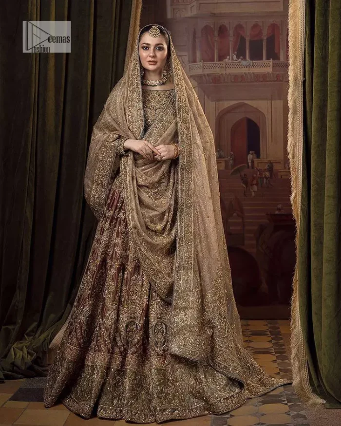 This alluring outfit is surely any girl’s dream. The hazel blouse is a magnificent choice which is ornamented with golden embroidery that wins everyone's hearts at the very first glance. It is further intensified with tilla, dabka, kora, Kundan and stones. Hand-crafted details on the full sleeves of this beautiful nikah dress make it the epitome of beauty. It is coordinated with a lehenga which is decorated with the finest details that are your first priority for the wedding. The lehenga has a huge flare to fulfil the dreamy look. Complete this article with a dupatta that is adorned with four-sided embellished borders and sparkling sequins to make your day.