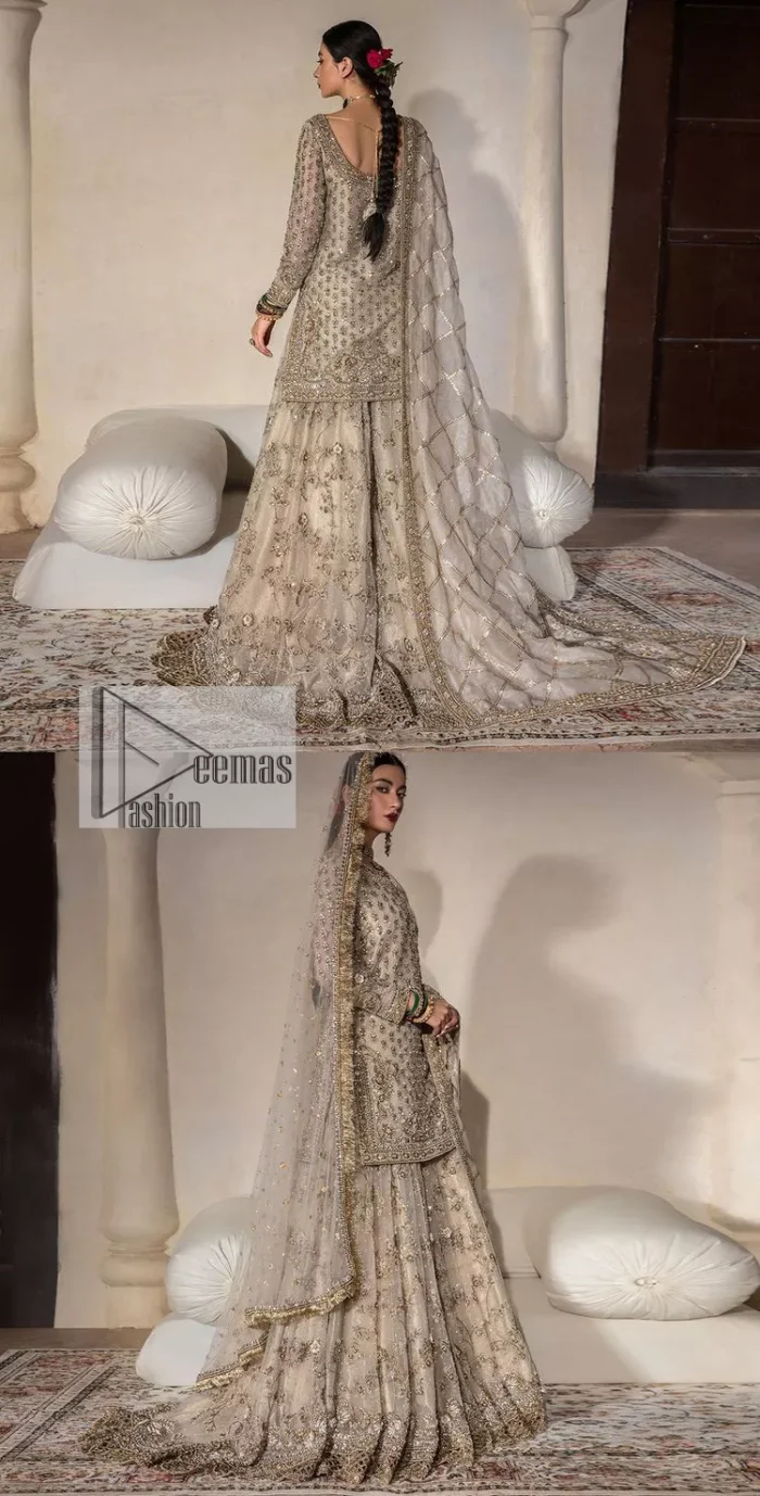 Unravel your inner density with our ivory nikah outfit. DeemasFashion presents this outfit which is embellished with light golden embroidery that further intensifies with tilla, dabka, kora, Kundan and the real magic of Zardozi. The ivory short shirt has boat shape neckline that is the epitome of royalty and grace. In addition to this, the embellished full sleeves also give a stunning touch to the shirt. It is coordinated with scalloped sharara making it a perfect choice to pair with the short shirt. Finish this outfit with a dupatta framed with four-sided embellished borders that gives you an impressive appearance on the Big day.