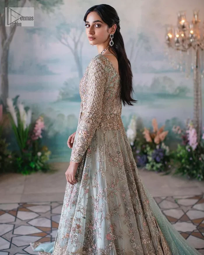 Unique embroidery designs to add some sparkle to your style on your Nikah! Light blue angrakha maxi with delicate multiple colour embroideries and intricate hand embellishments of tilla, dabka, kora, Kundan and crystals on the classic silhouette. Designed to flaunt your best features, the full sleeves carry beautiful embroidery with a square neckline. The following maxi along with the back train lehenga gives this outfit a unique look. Paired with a dreamy dupatta framed with embellished borders, this look is the epitome of ethereal and easy elegance.