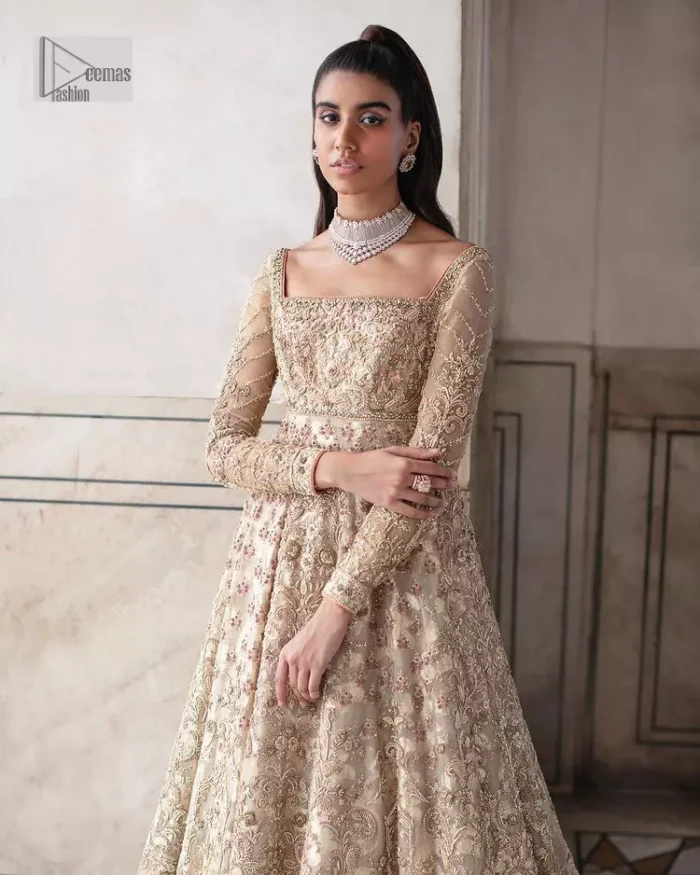 Ooze beauty and elegance in this simple yet amazing ensemble. This walima outfit in the off-white colour is a  magnificent look emblazoned with beautiful light golden embroidery which is further enhanced with tilla, dabka, kora, Kundan and the real magic of thread. The square neckline and full sleeves are unique in style and have classy look and perfect choice for the traditional bride. It is paired up with a lehenga which is adorned with beautiful embroidery. Father, the lehenga has a back-train to make this outfit lovely. Complete this with a dupatta framed with four-sided borders and sequins sprayed all over to add extra glam to this masterpiece.
