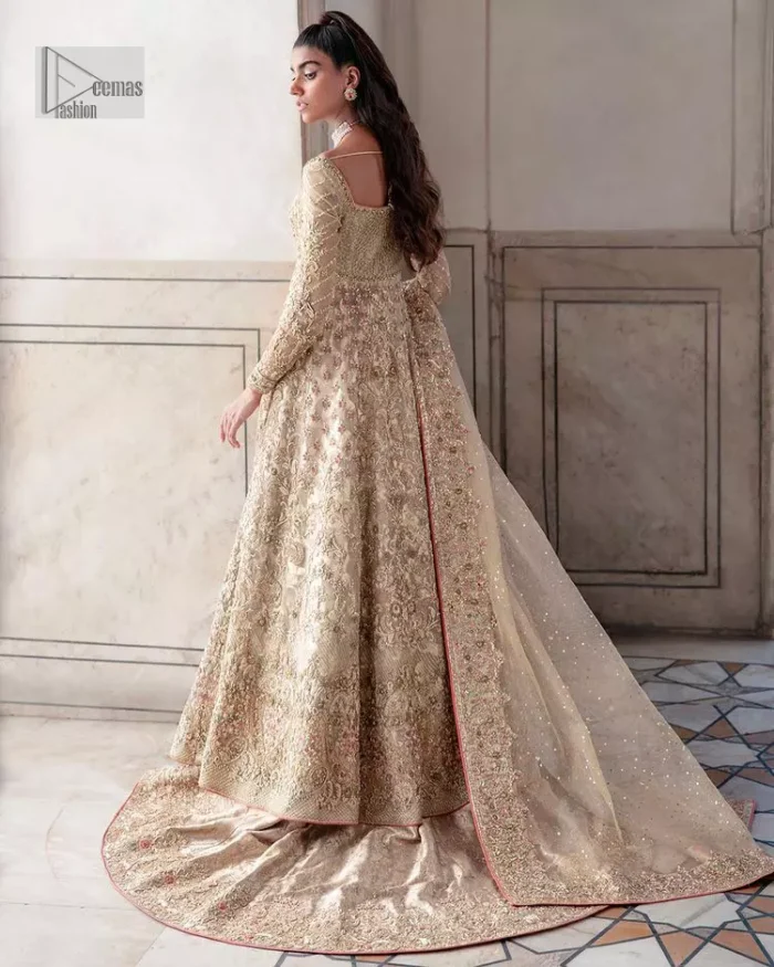 Ooze beauty and elegance in this simple yet amazing ensemble. This walima outfit in the off-white colour is a  magnificent look emblazoned with beautiful light golden embroidery which is further enhanced with tilla, dabka, kora, Kundan and the real magic of thread. The square neckline and full sleeves are unique in style and have classy look and perfect choice for the traditional bride. It is paired up with a lehenga which is adorned with beautiful embroidery. Father, the lehenga has a back-train to make this outfit lovely. Complete this with a dupatta framed with four-sided borders and sequins sprayed all over to add extra glam to this masterpiece.